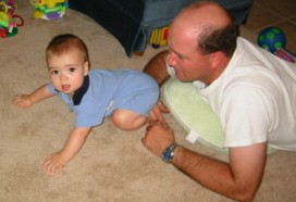 Alex (7 mos) crawls with Daddy Brian 