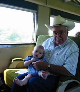 Bob Burgess "Old Gramps" rides the train with great-grandson