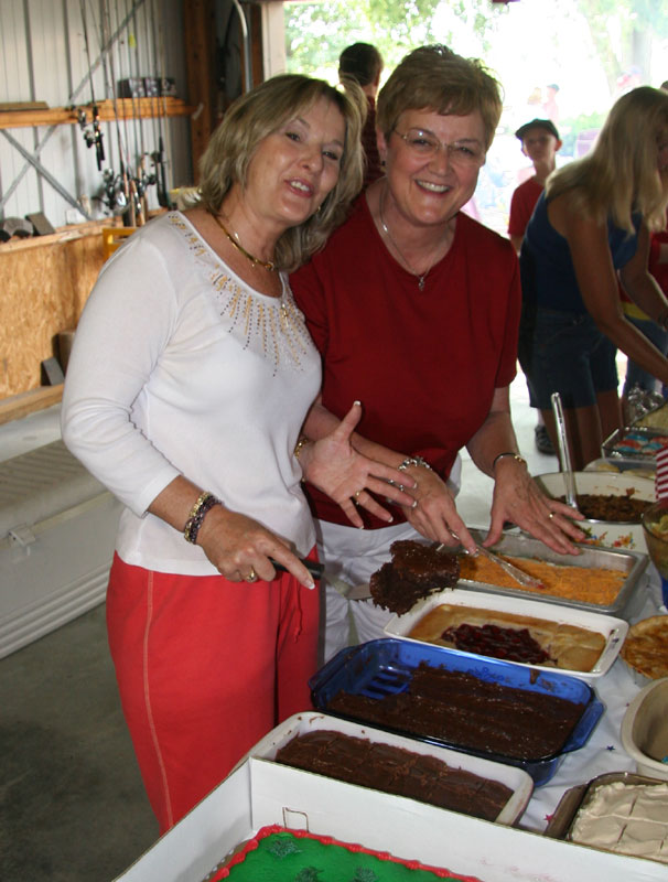 Sally and Karen showing off their home-cooked items