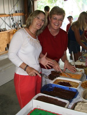 Sally and Karen showing off their home-cooked items