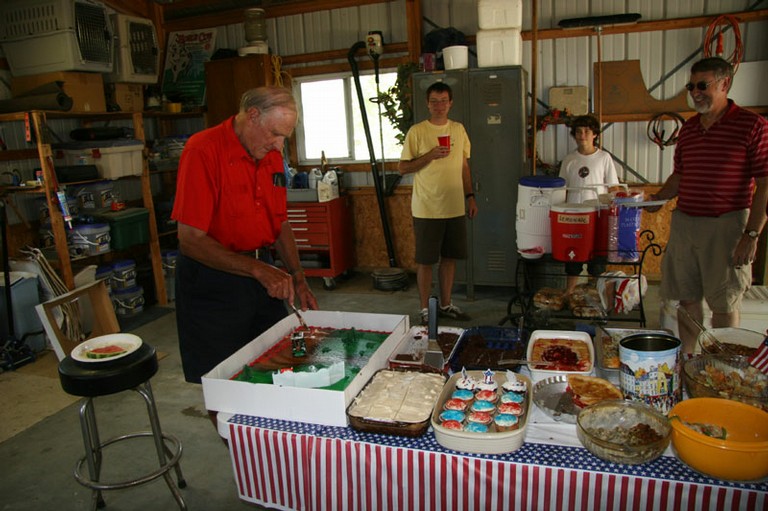 Denny cutting the cake