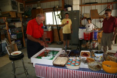 Denny cutting the cake